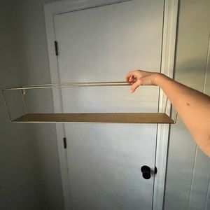 Gold wall shelf